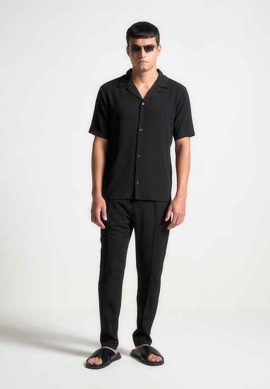 Karottenhose aus Seersucker - Schwarz